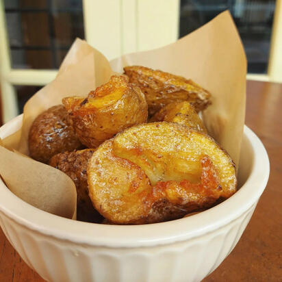 Crushed & Fried Potatoes With Black Garlic Butter